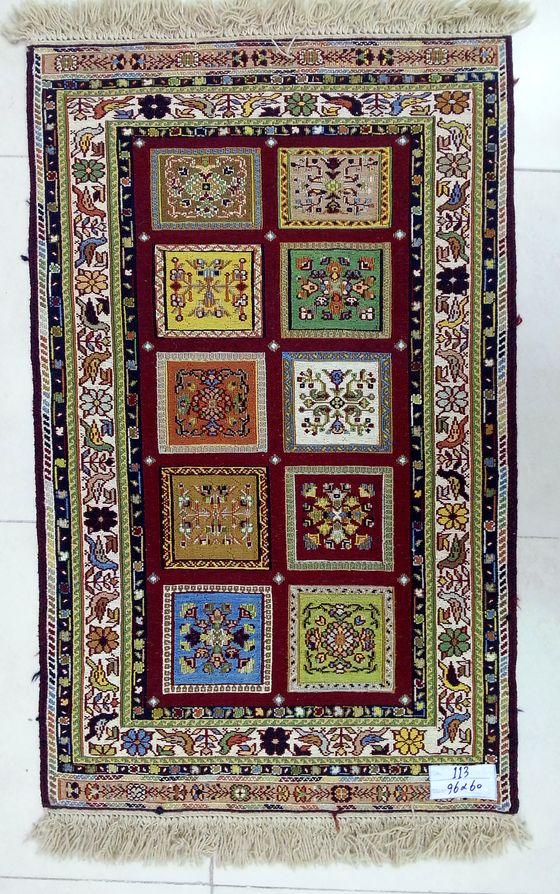 Carpet with a grid of floral panels