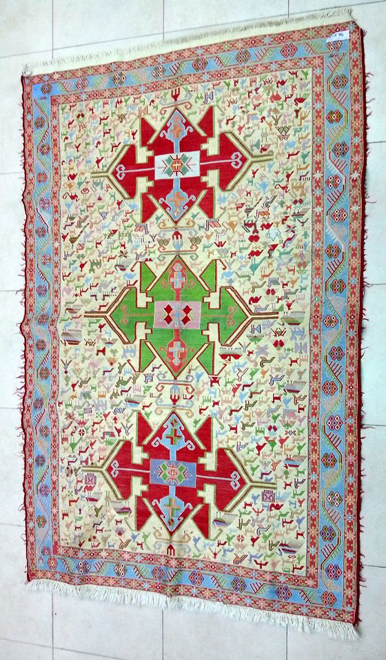 Pale carpet with red medallions