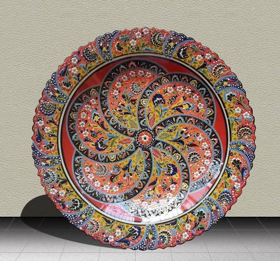 Hand-painted ceramic plate in orange and blue
