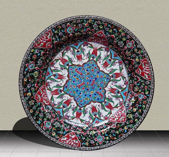 Hand-painted ceramic plate with a blue star