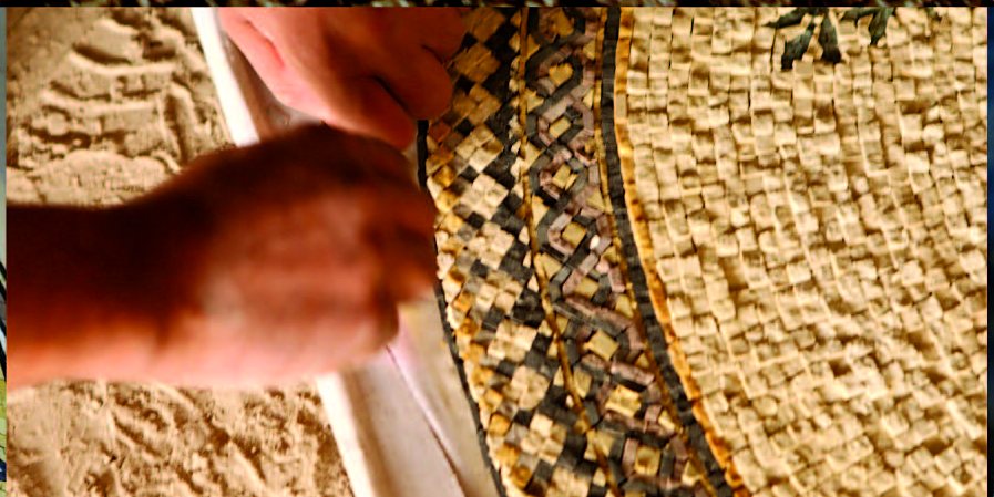 Hands working on the edge of a round mosaic