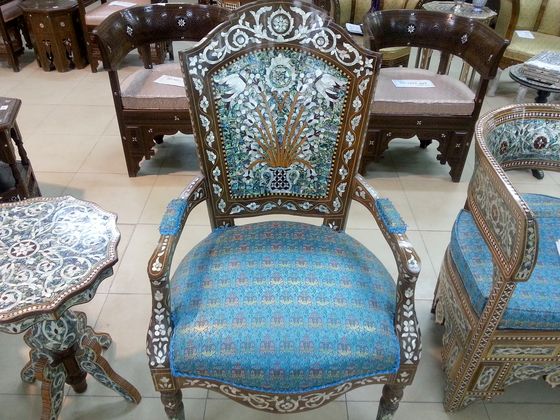 Inlaid armchair upholstered in blue