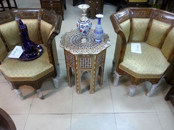 Pair of chairs with an inlaid side table