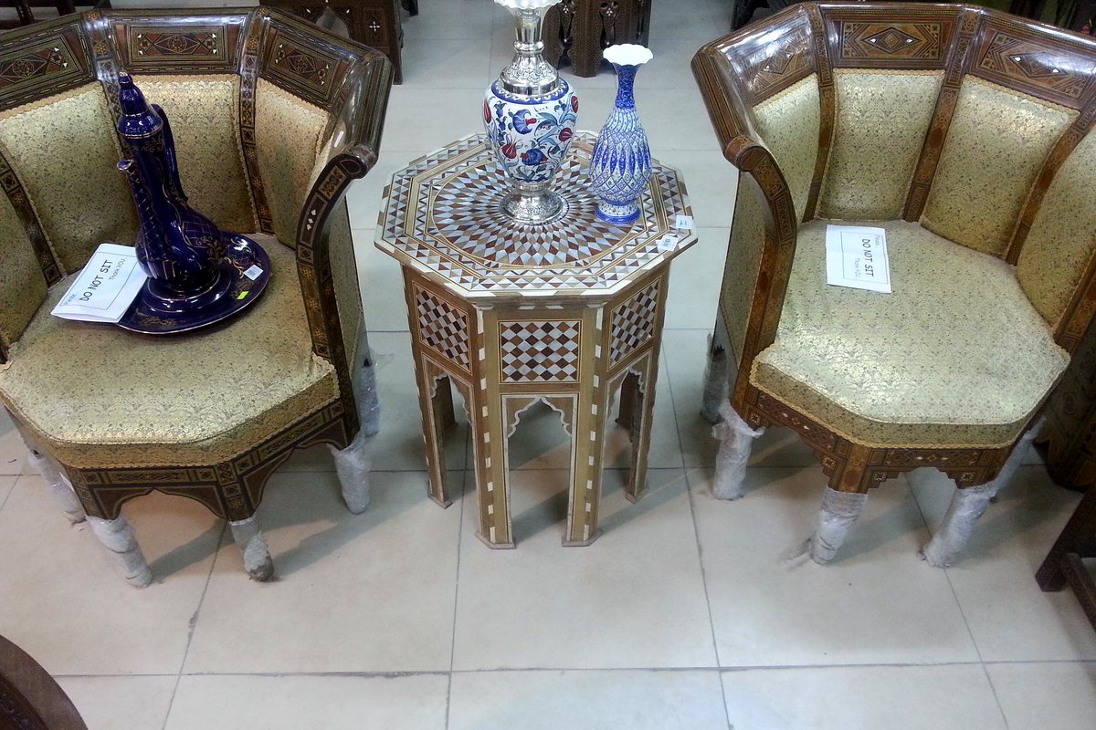 Chairs and an inlaid side table in the furniture hall