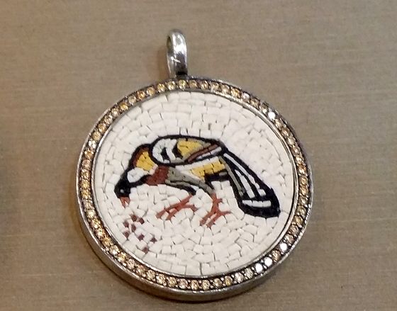 Mosaic pendant with a bird, framed with yellow stones